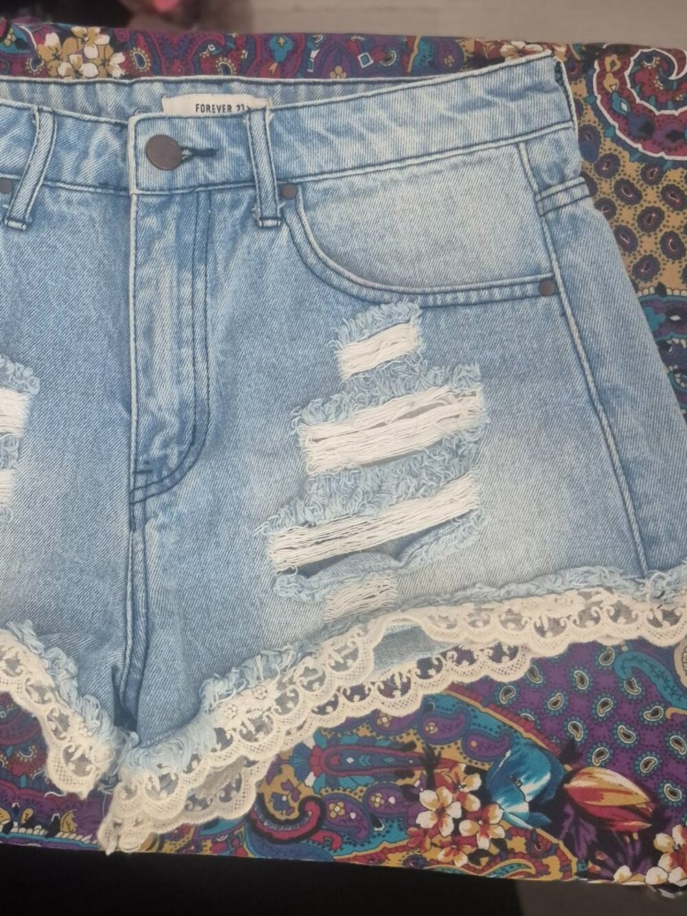 Forever 21 Ladie's distressed denim shorts, laced trim, 26" waist
